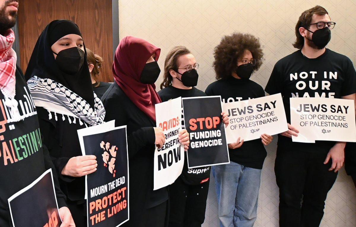 Ahead of the first night of Hanukkah, Jewish and some non-Jewish constituents of Rep. Sharice Davids are calling for a ceasefire for the war in Gaza during peaceful occupation of Davids’ office on Dec. 7, 2023, in Overland Park.. Members of the group waited to enter Davids office.