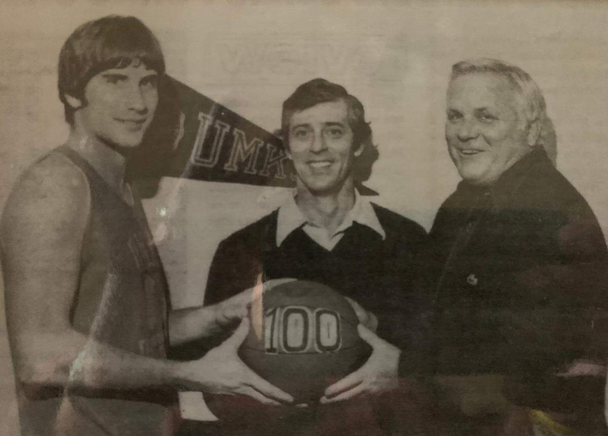 UMKC Hall of Fame coach Darrell Corwin (middle) poses with co-captain Mark Hatfield (left) and the school’s AD. Corwin finished his career with 118 wins.