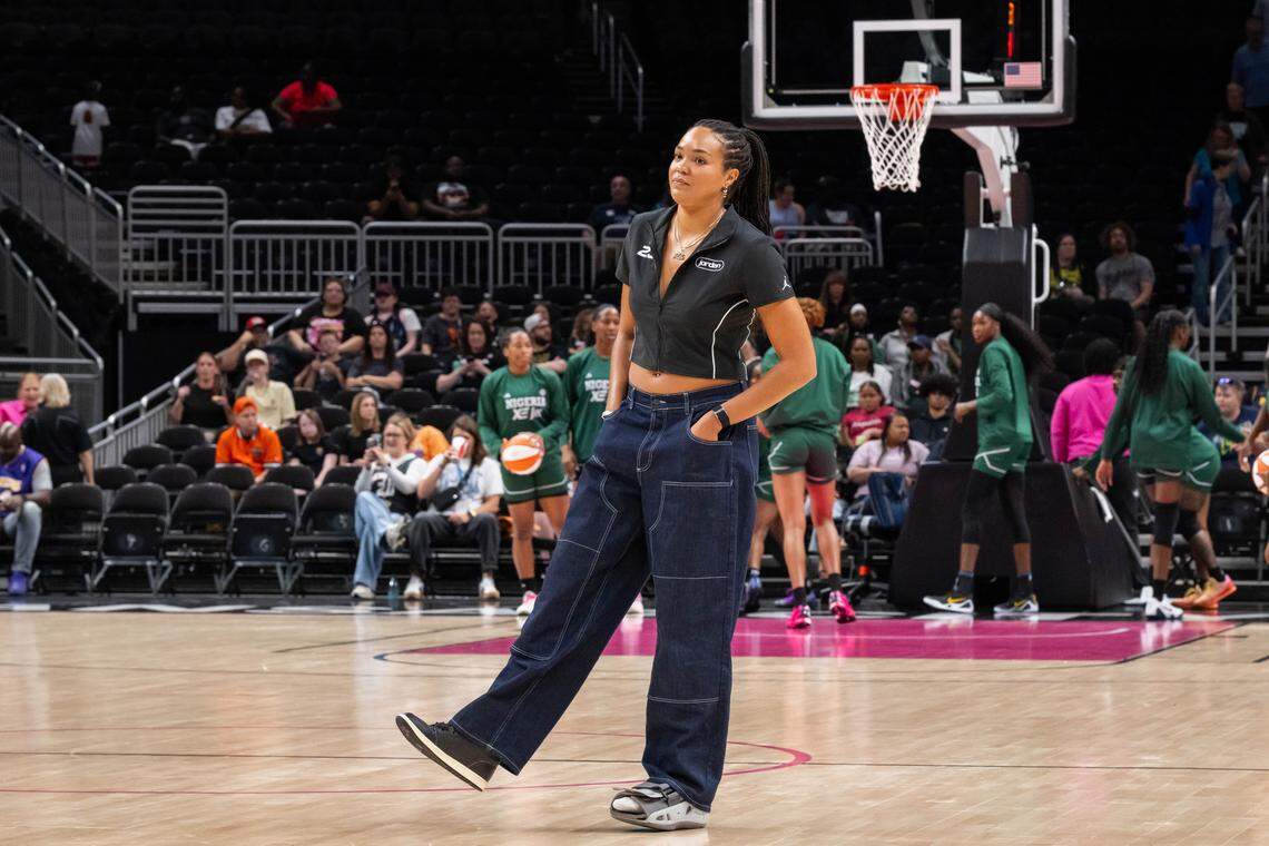 Minnesota Lynx forward Napheesa Collier stands at midcourt prior to a WNBA preseason game on Monday, April 27, 2026, at T-Mobile Center. Collier missed the game due to injury.