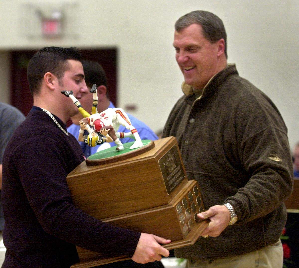 In 2001, former Kansas City Chiefs player Ed Lothamer presented the annual Bobby Bell Award to Anthony Simone of St. Pius X during a ceremony at the Olathe North High School gym.