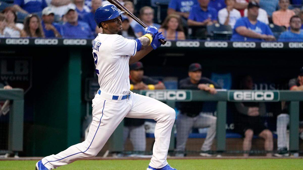 Kansas City Royals’ Michael A. Taylor hits an RBI single during the first inning of a baseball game against the Cleveland Indians Wednesday, Sept. 1, 2021, in Kansas City, Mo. (AP Photo/Charlie Riedel)