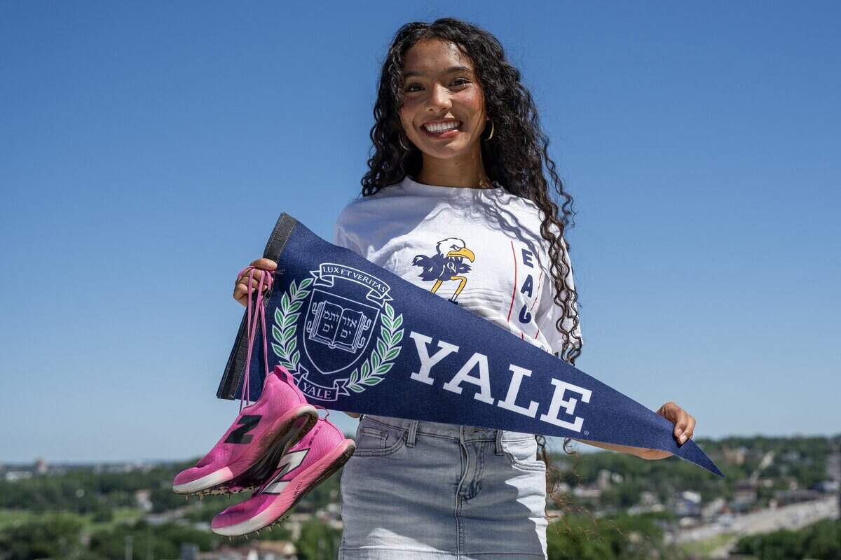 Scholar-Athlete Award recipient Avani Hocker Singh poses for a portrait with a Yale University pennant and her track spikes on Monday, June 15, 2026, in Kansas City.