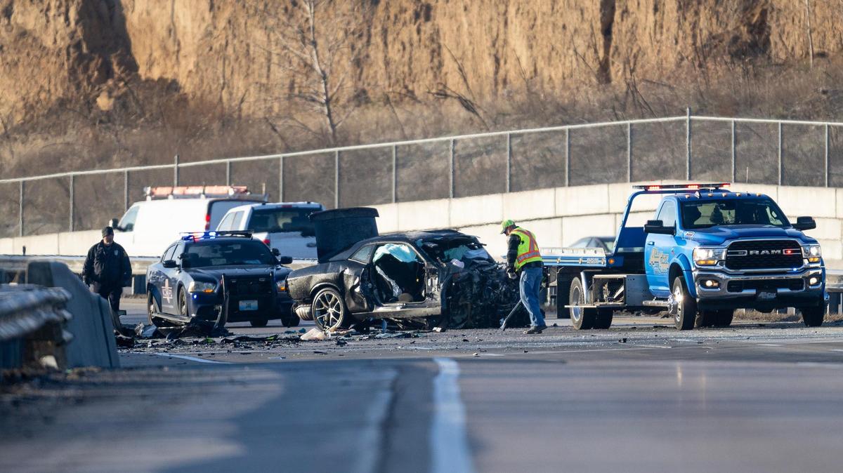 Kansas City police work the scene of a fatal crash on Interstate 435 near Missouri 210 highway on Tuesday in Kansas City. Two people died after a vehicle being chased by police was headed the wrong way on I-435 and crashed head-on into another vehicle.