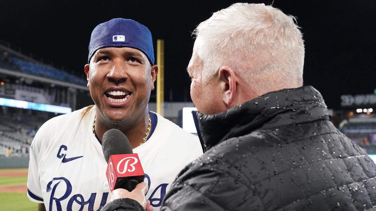 Kansas City Royals catcher Salvador Perez (13) talks with Bally Sports announcer Joel Goldberg after the win over the Houston Astros at Kauffman Stadium on April 9, 2024.