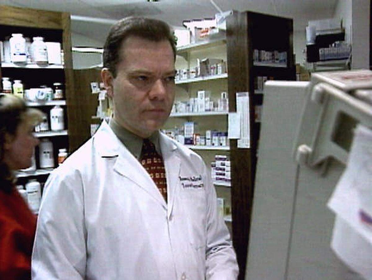Robert Courtney, shown here in one of his Kansas City pharmacies in 2001, was well-known and respected among local pharmacists who described him as serious and quiet.