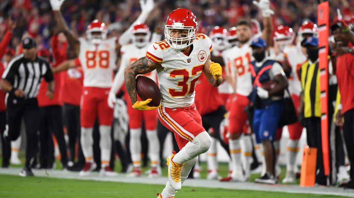 Kansas City Chiefs free safety Tyrann Mathieu (32) runs a first half interception thrown by Baltimore Ravens quarterback Lamar Jackson back for touchdown during a NFL football game, Sunday, Sept. 19, 2021, in Baltimore. (AP Photo/Terrance Williams)