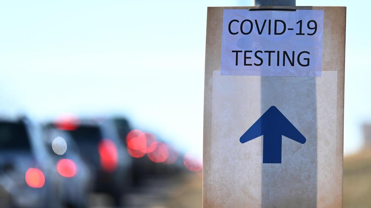 An arrow guides drivers to a COVID-19 testing site in the parking lot at Kauffman Stadium on Monday, January 10, 2022.