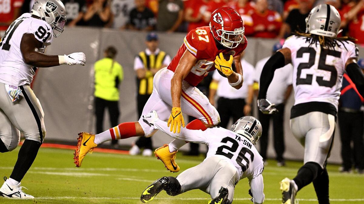 The Chiefs’ Travis Kelce jumped over the Raiders’ Rock Ya-Sin on his way to scoring his second touchdown during the second half of Monday night’s game at Arrowhead Stadium. The Chiefs won, 30-29.