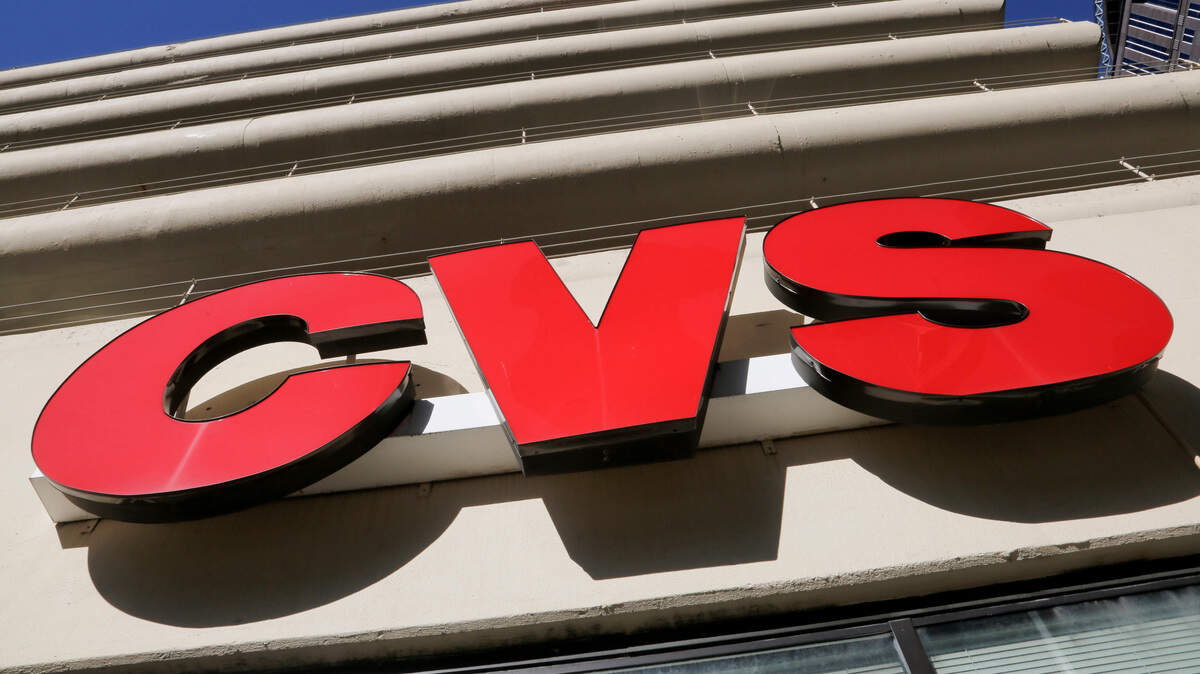 This Jan. 26, 2018, file photo shows a CVS Pharmacy sign.