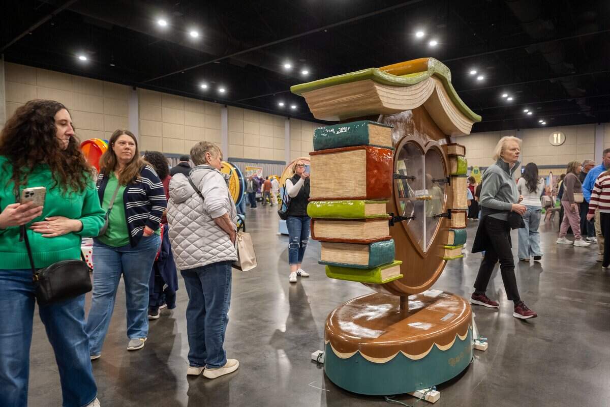 A heart with a built-in bookcase on display during the first public exhibition of the new Parade of Hearts sculptures on Saturday, April 4, 2026, in Overland Park.