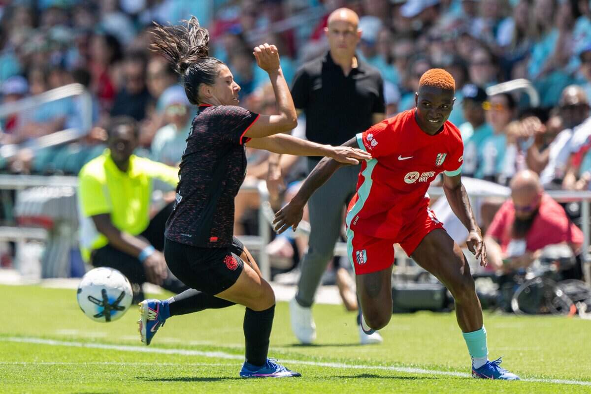 Kansas City Current forward Temwa Chawinga (6) attempts to run around a Portland Thorns FC player in the Current's match vs. Portland Thorns FC on Sunday, May 24, 2026, at CPKC Stadium.