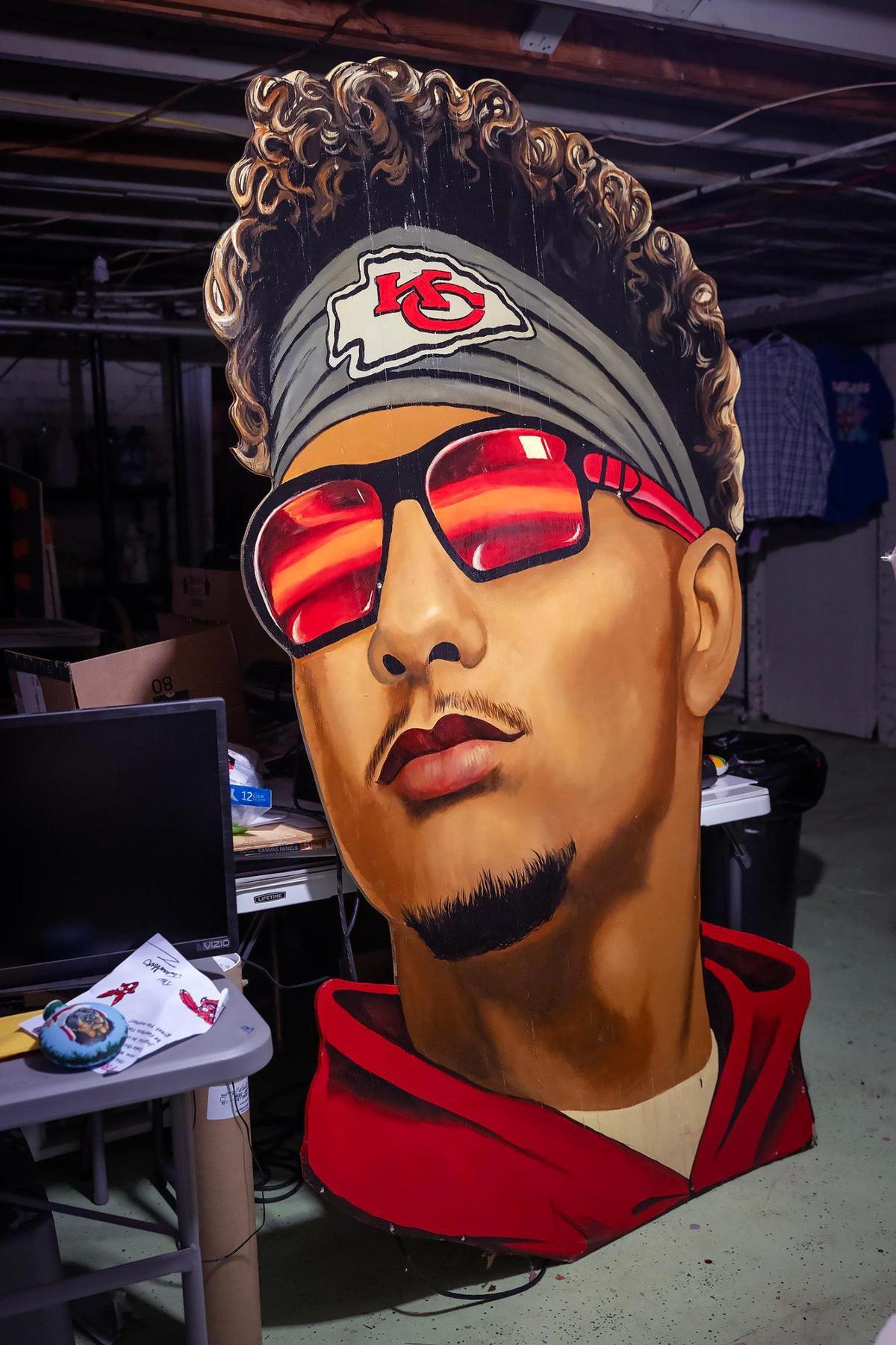 Self-taught artist Jeff Parson’s towering cutout portrait of Kansas City Chiefs quarterback Patrick Mahomes on Wednesday in his basement studio in Riverside, Missouri. The cutout was previously displayed in his front yard Chiefs display on Gateway Drive in Riverside. Parson cannot bring himself to part with the artwork of Mahomes.