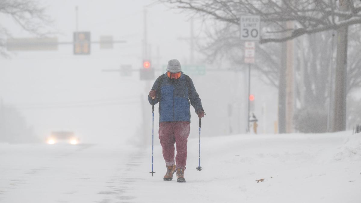 Arnold Ressin of Westwood walks back from a closed Walmart location during a snowstorm on Sunday, Jan. 5, 2025. Ressin wanted a few ingredients for a chili he was making before the Chiefs game.