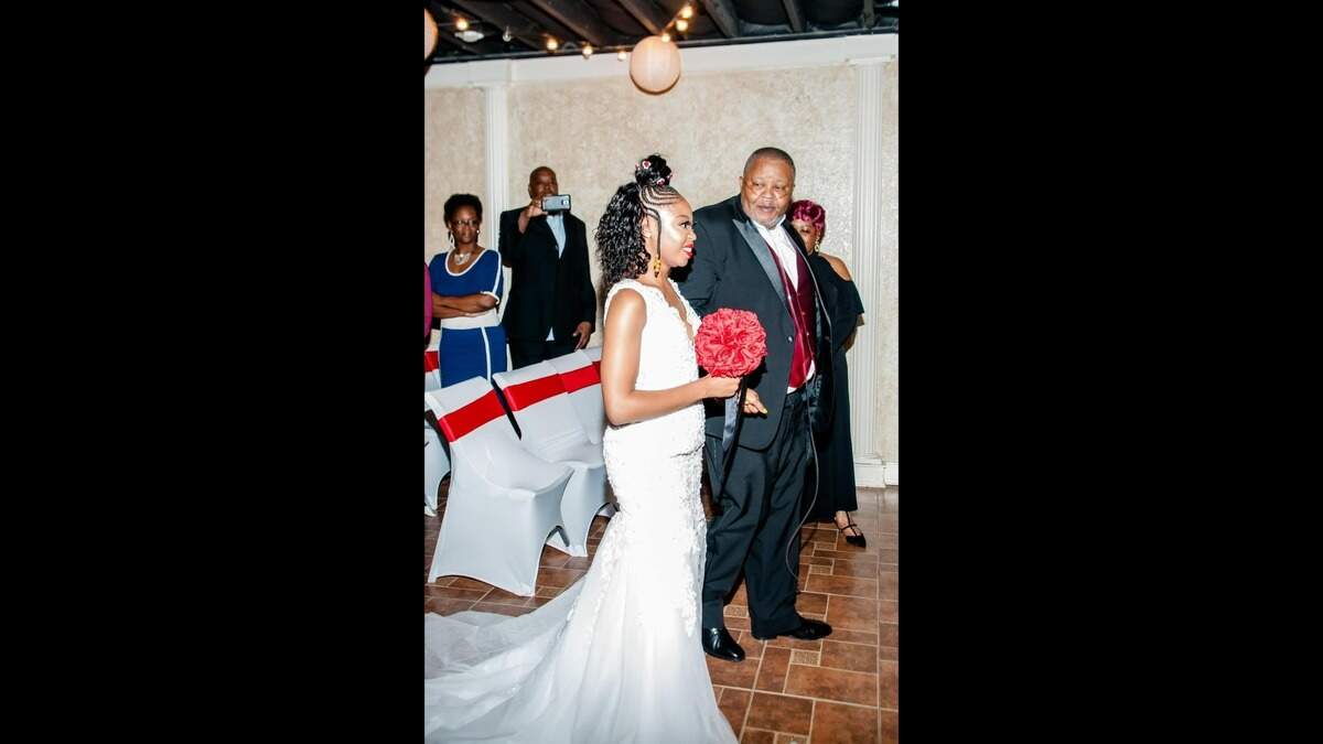 Larry Thomas with daughter Rosie Warren-Thomas, walking her down the aisle on her wedding day.