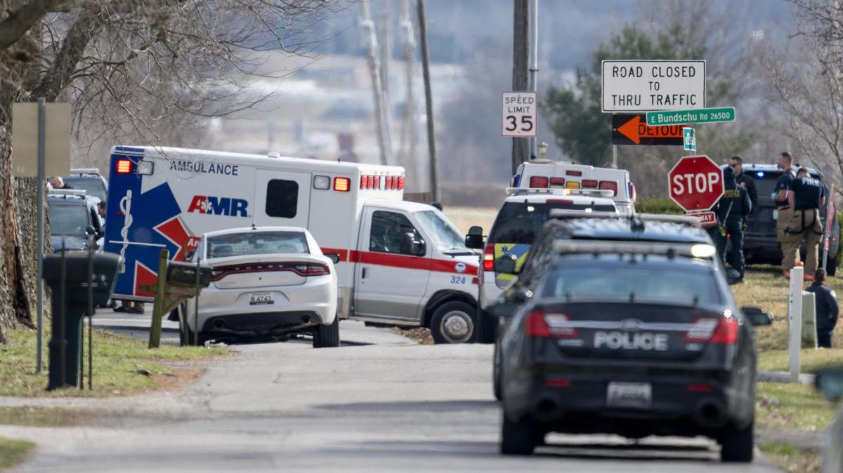 An ambulance leaves the scene of an officer involved shooting near the intersection of Elsea Smith Road and Bundschu Road on Thursday, Feb. 29, 2024, east of Independence.