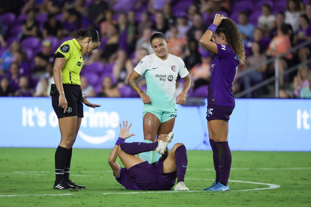 Orlando Pride forward Marta is attended to while on the ground after a run-in with a KC Current player during Friday evening’s NWSL match at Inter&Co Stadium.