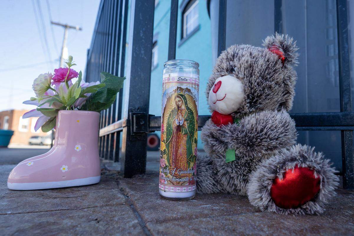 A teddy bear and Virgin of Guadalupe candles paid tribute were outside of  2801 Southwest Blvd., following an shooting on Sunday, Feb. 15, 2026, that left two women were dead and two others injured. The incident happened at a Kansas City nightclub on the city's Westside.