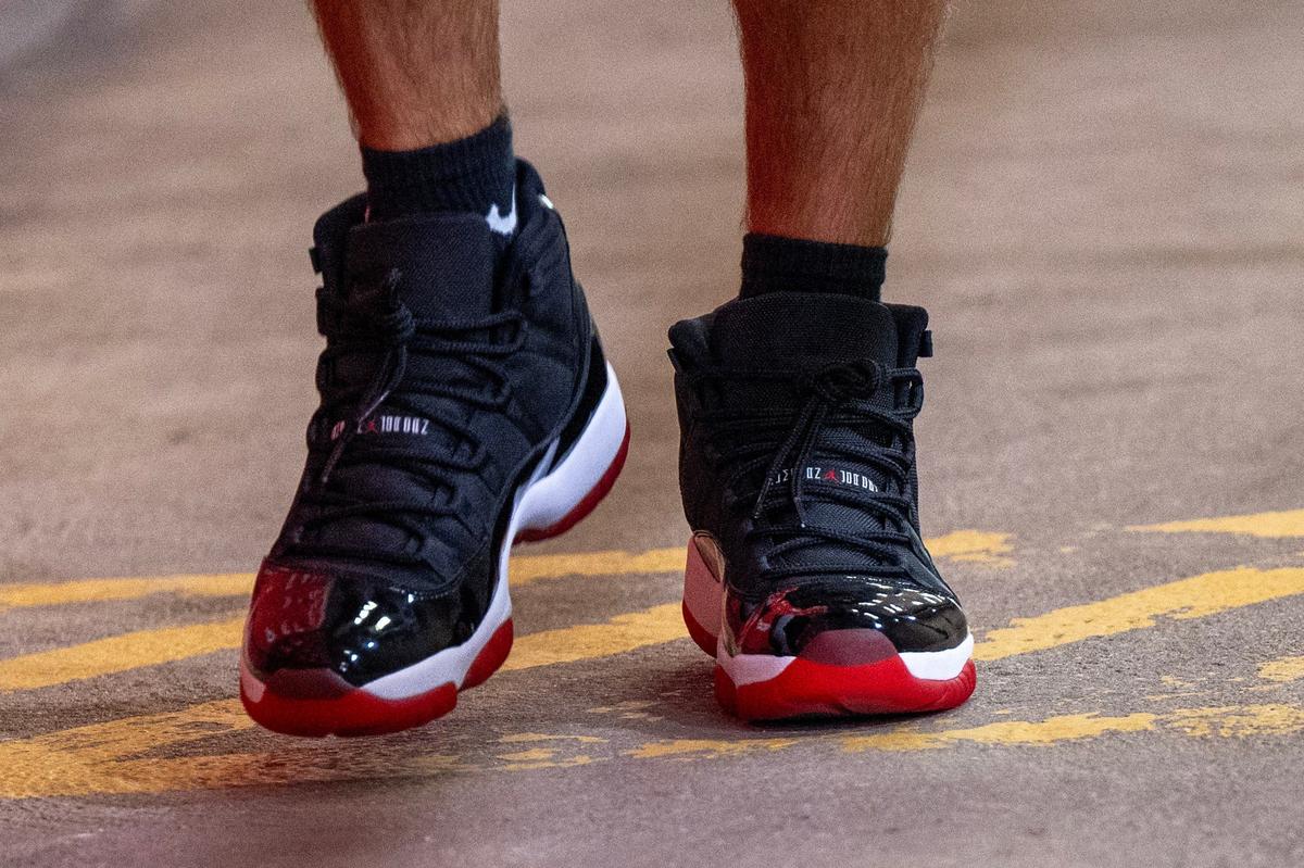 Kansas City Chiefs tight end Travis Kelce walks down the tunnel wearing Nike Air Jordans before a game on Saturday against the Detroit Lions.