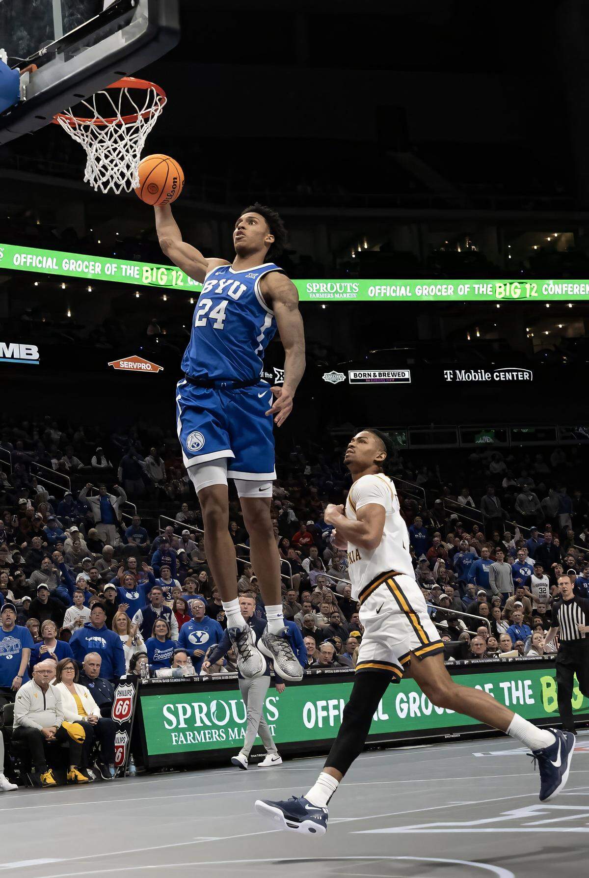 BYU Cougars forward Dominique Diomande (24) goes for two as West Virginia defends during the first half of the Big 12 Men's Basketball Tournament at T-Mobile Center on Wednesday, March 11, 2026, in Kansas City.
