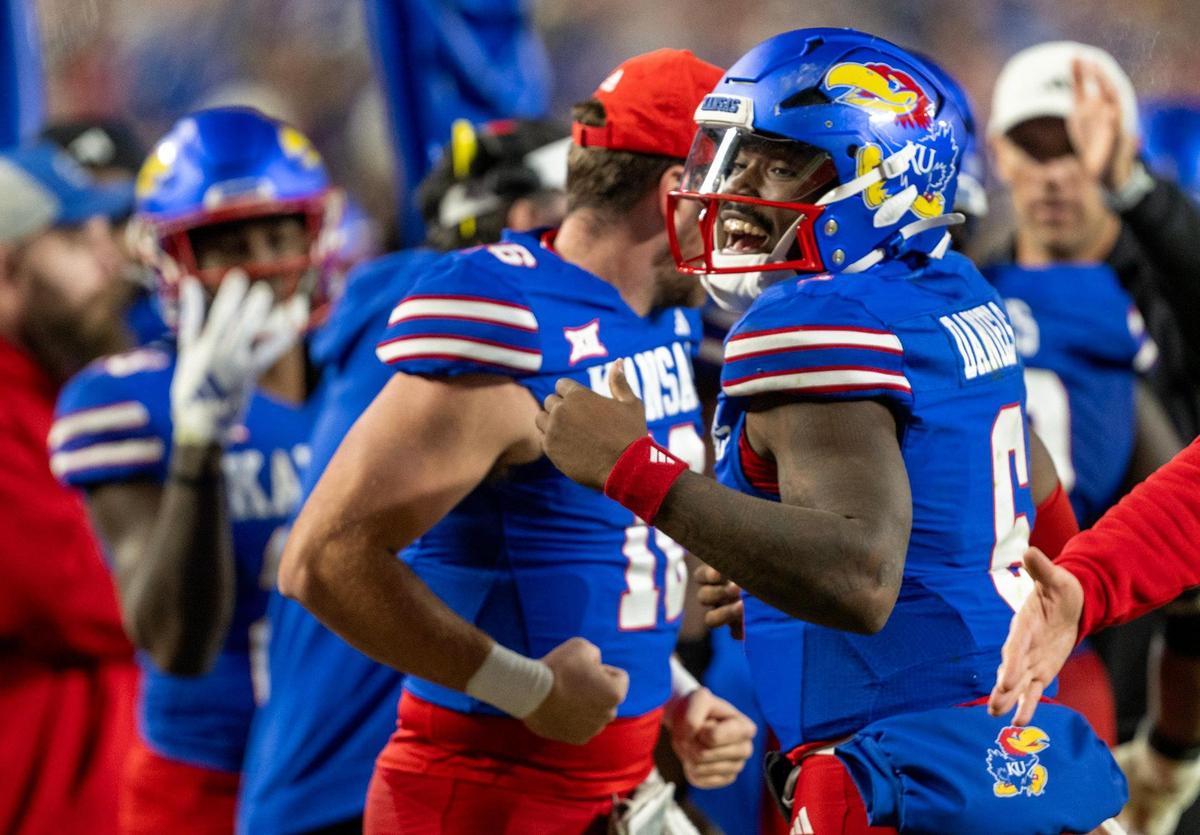Kansas Jayhawks quarterback Jalon Daniels (6) was all smiles late in the second half as the Jayhawks finished off a 37-21 victory over the Colorado Buffaloes on Nov. 23, 2024, at GEHA Field at Arrowhead Stadium.