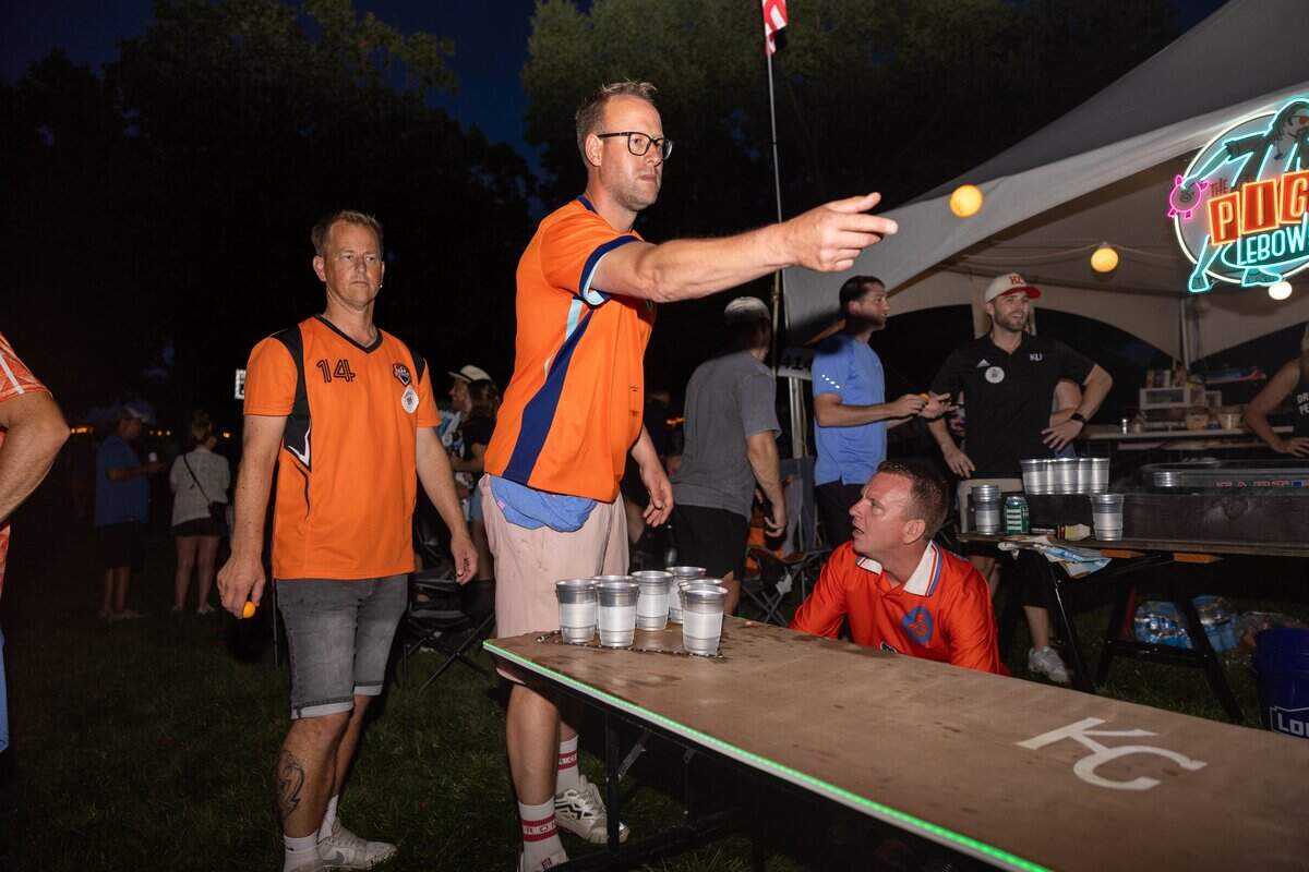 Jacob Krijnen, from Texel, Netherlands, throws the pingpong ball during a game of beer pong at The Great Lenexa BBQ Battle on Friday, June 26, 2026.