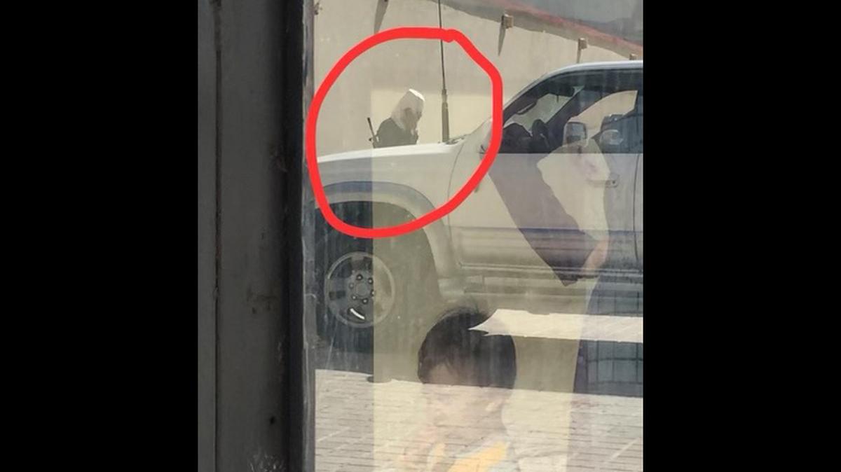 Photo of Taliban soldier just outside the hotel in Mazar-e-Sharif where 383 people hid before escaping Afghanistan as part of Operation Bella.