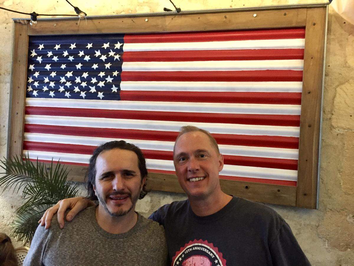 Rosie’s Smokehouse owner Louis Khenane with Mitch Benjamin.