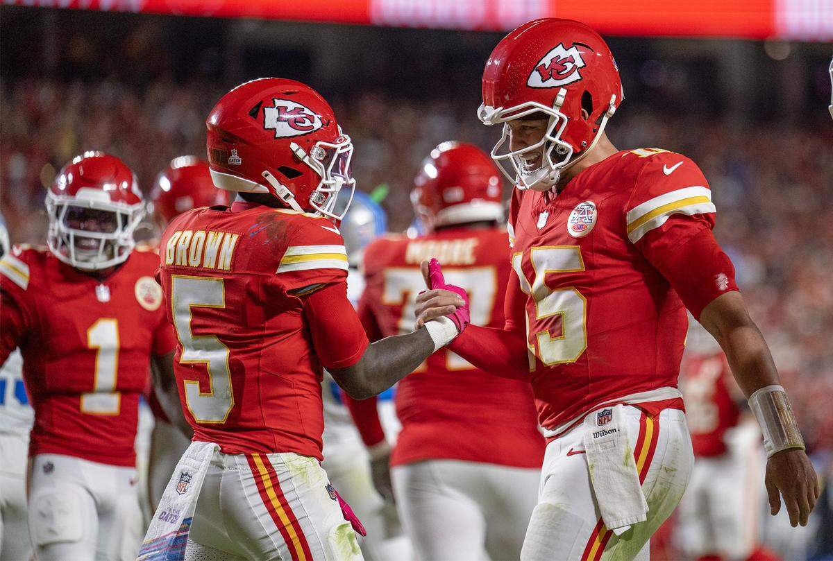 Kansas City Chiefs quarterback Patrick Mahomes (15) congratulates wide receiver Marquise Brown (5) after he scored a touchdown in the third quarter against the Detroit Lions at GEHA Field at Arrowhead Stadium on Sunday, October 12, 2025, in Kansas City.