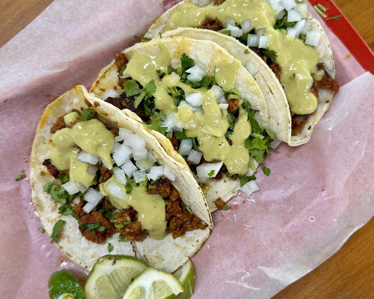 Three al pastor tacos from Carnicería y Tortillería San Antonio