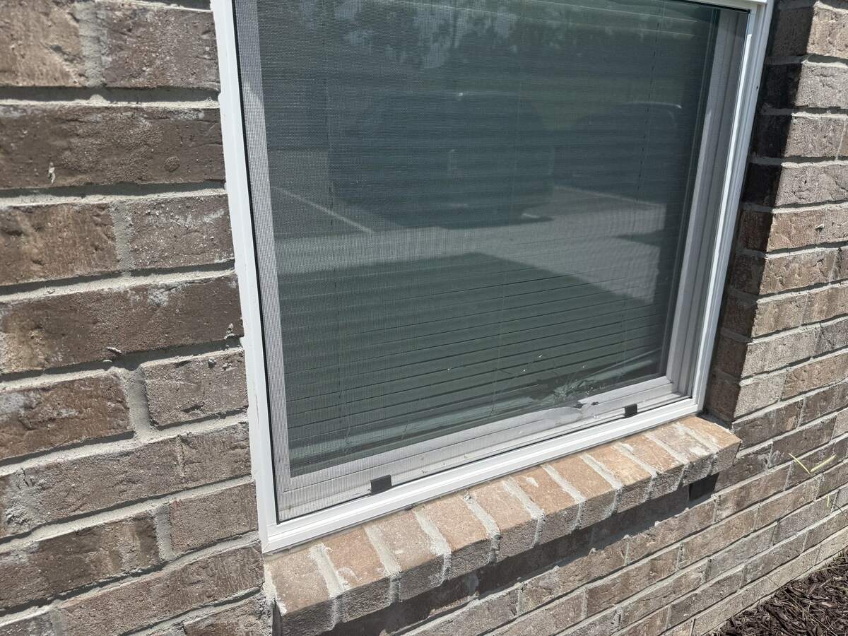 A window was hit during a shooting Saturday, June 27 at The Depot on Old Santa Fe apartments. The shooting left two teenagers dead.