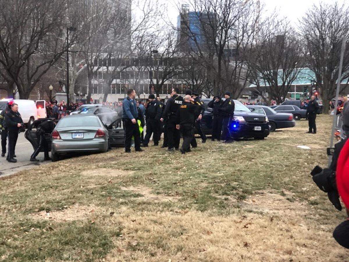 A police chase down the length of the Super Bowl parade route in downtown Kansas City, hours before the parade was to begin, ended near Grand Boulevard and Pershing Road.