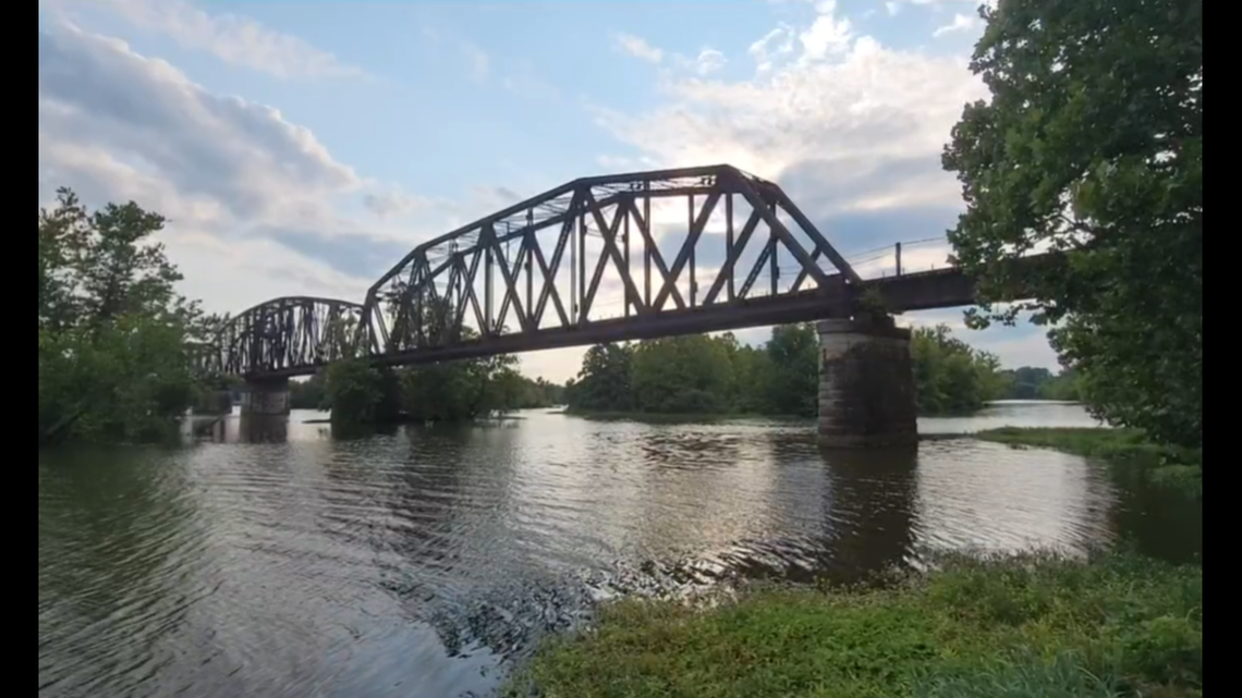 Three people were hit by a train, one fatally, while taking photos on a bridge in Van Buren, Arkansas, police said.