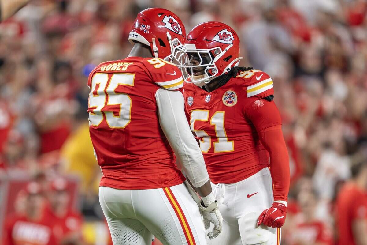 Kansas City Chiefs defensive end Chris Jones (95), left, and R. Mason Thomas (51) celebrate Thomas's sack on Denver Broncos quarterback Bo Nix (10) in the second quarter during the the season opener at Arrowhead Stadium on Monday, Sept. 14, 2026, in Kansas City.