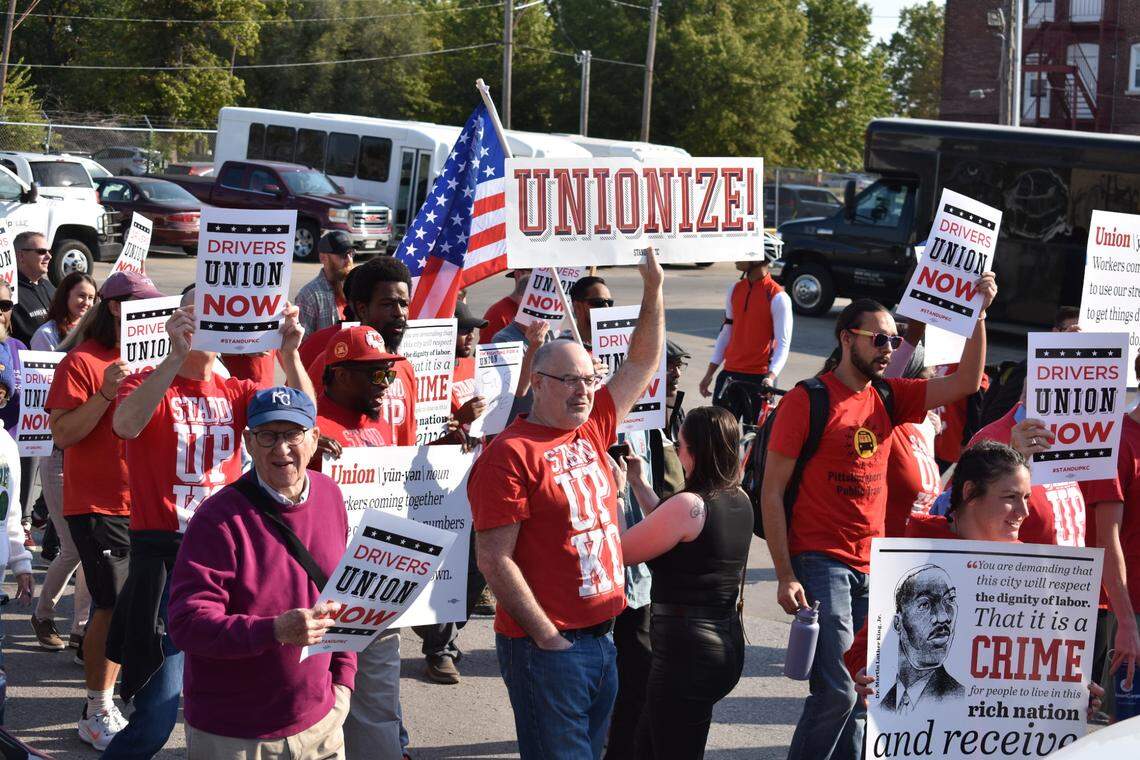 IRIS microtransit drivers and union allies march by the Kansas City headquarters of zTrip, the taxi company that operates the IRIS program with funding from the Kansas City Area Transit Authority, on Thursday, Oct. 10, 2024.
