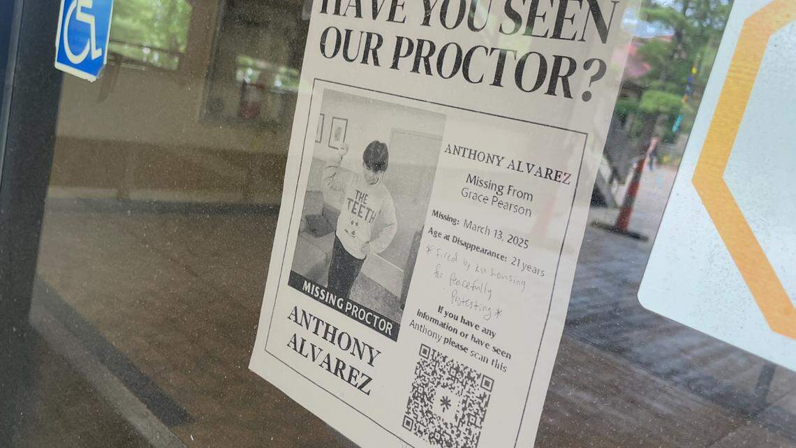 A flier posted outside Grace Pearson Scholarship Hall shows support for Anthony Alvarez, the former proctor at the dorm who was terminated in March. Alvarez is now suing the University of Kansas.
