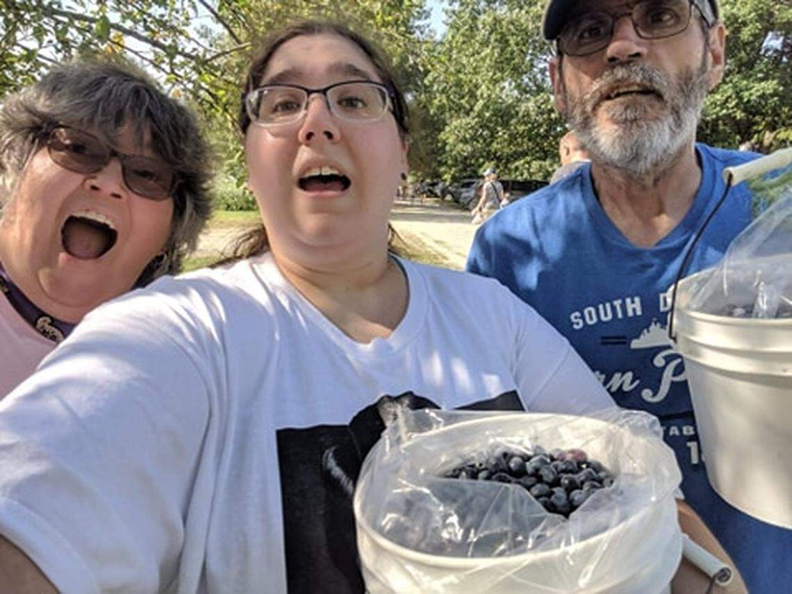George Robare (right) is the first Kansas corrections employee to die from COVID-19.  His wife, Susan (left) and daughter, Rachel (right) are asking people to take the virus seriously. 