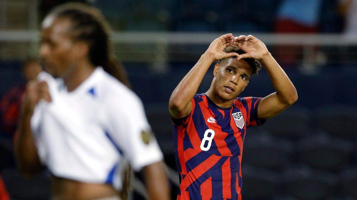 U.S. forward Nicholas Gioacchini (right) reacts after scoring a goal against Martinique during the second half of a Gold Cup soccer match at Children’s Mercy Park in Kansas City, Kan., Thursday, July 15, 2021.