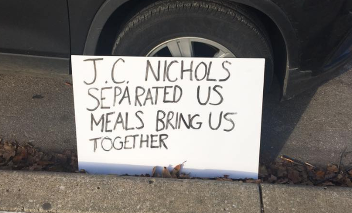 One week after Kansas City Health Department officials shut down Free Hot Soup KC’s meals with homeless people and others in local Kansas City parks, the food servers returned with more meals Sunday. This sign at one of the sites expressed one of the reasons they returned.