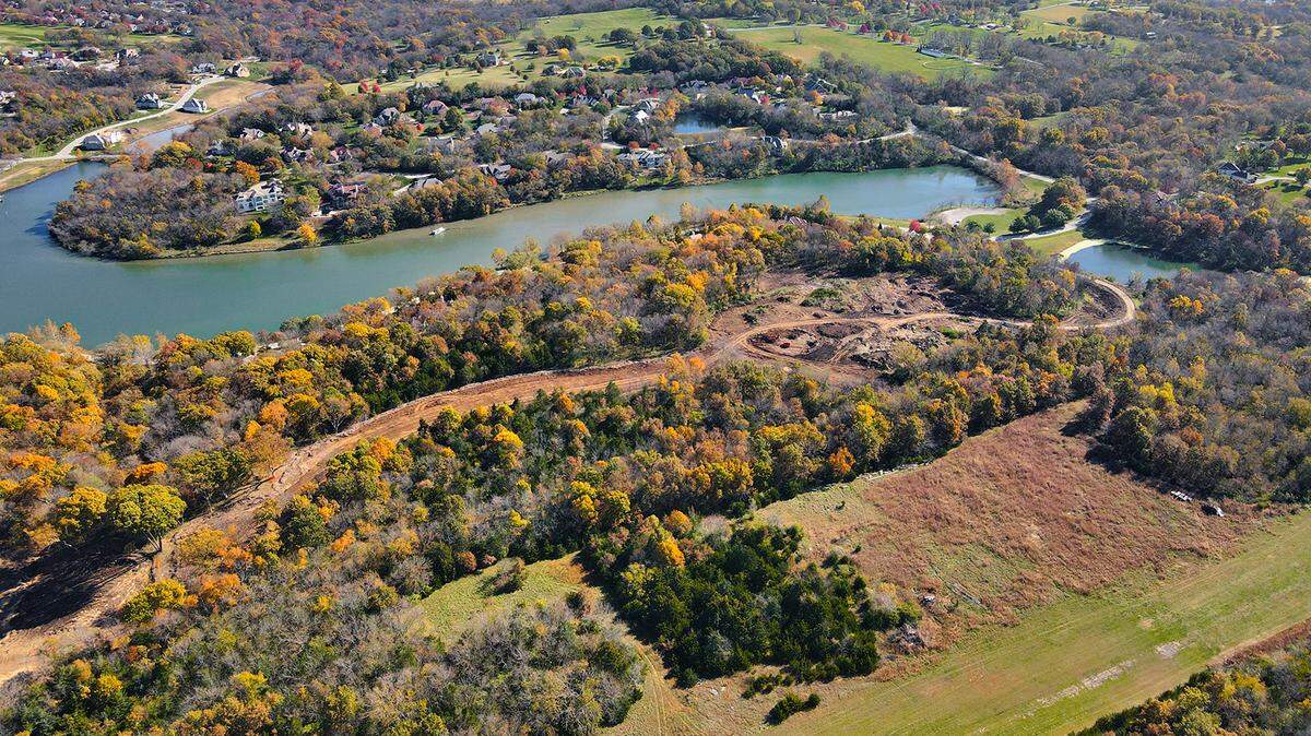 Stonehaven at Loch Lloyd will debut spring 2022, offering wooded acreage lots with new gated access to 167th Street and Kenneth Road.
