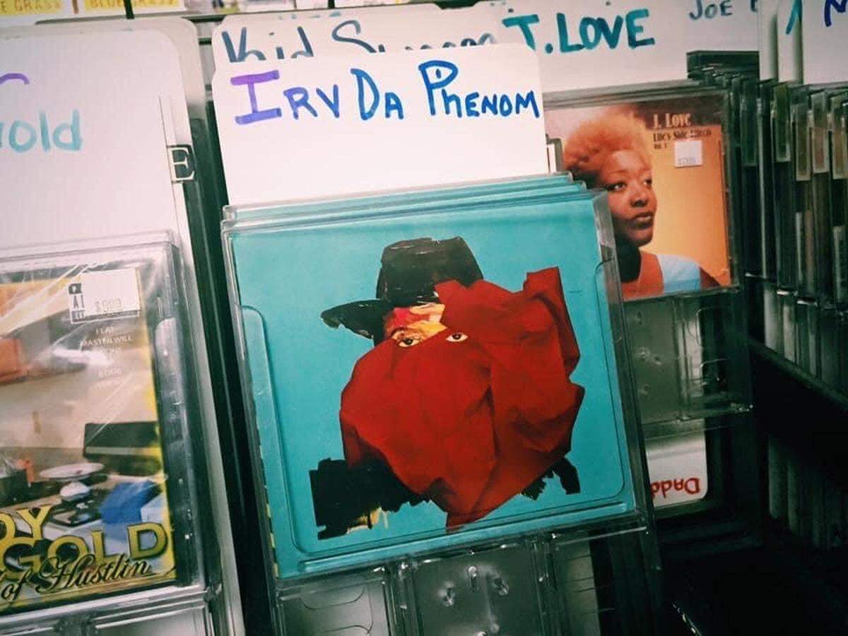 Copy of Mitchell Irving’s 2016 CD “Dream Big, Hustle Hard 2” on the racks of 7th Heaven’s music floor. 
