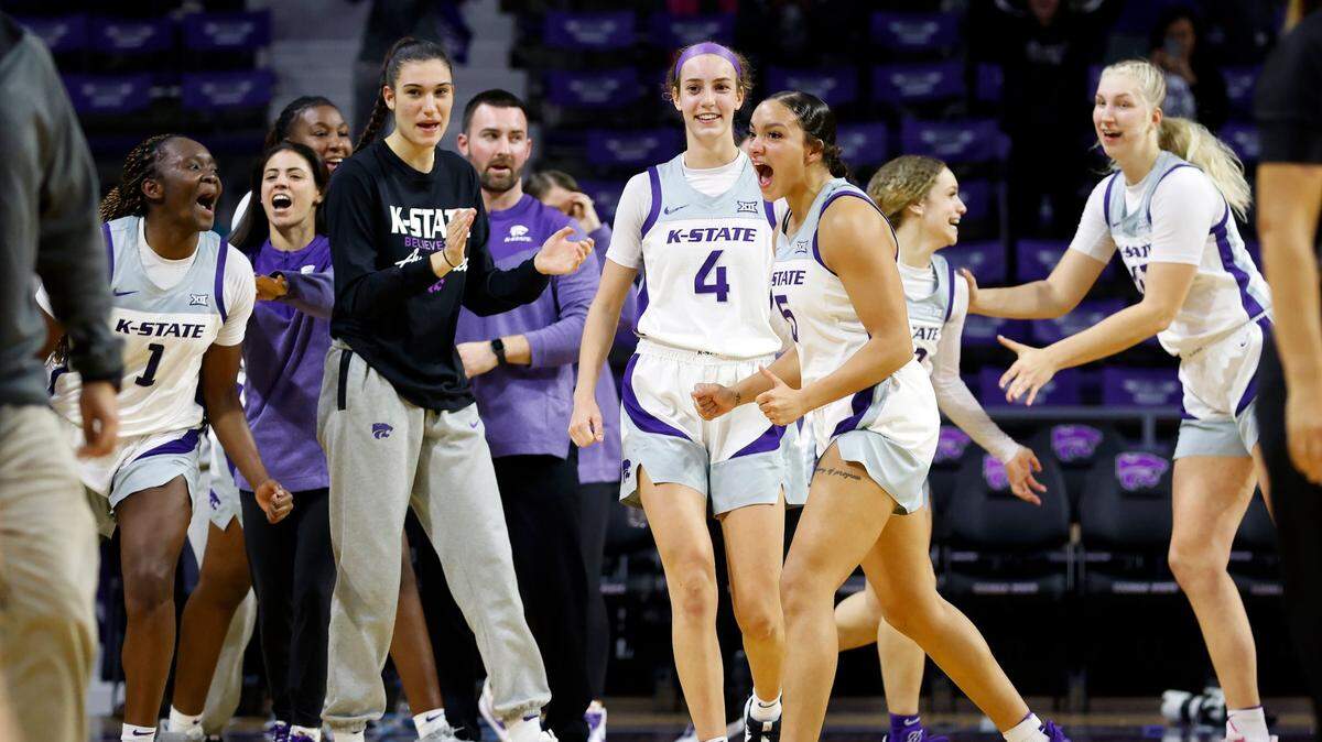 Kansas State players celebrate at the end of an NCAA basketball game on Thursday, Nov. 17, 2022, in Manhattan, Kan. Kansas State defeated Iowa 84-83.