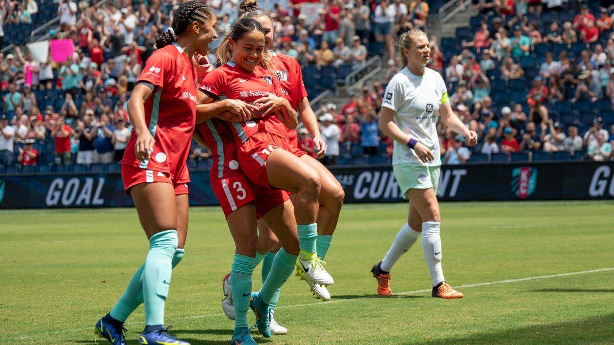 Kansas City Current midfielder Lo’eau LaBonta celebrates with teammates after scoring against Racing Louisville during a May match at Children’s Mercy Park.