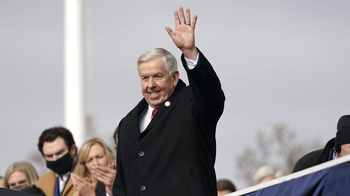 Missouri Gov. Mike Parson waves after being sworn in for his first full term as governor Monday, Jan. 11, 2021, in Jefferson City.