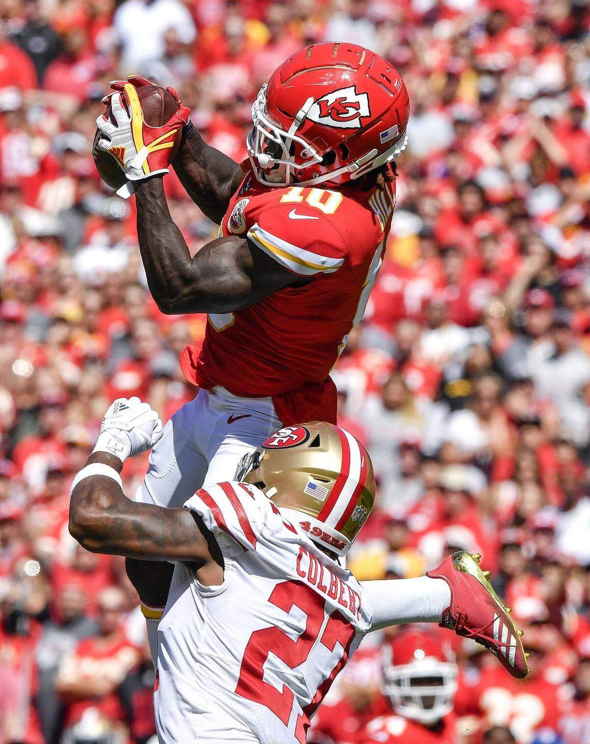 Kansas City Chiefs Tyreek Hill jumping for a catch in a 2018 game.