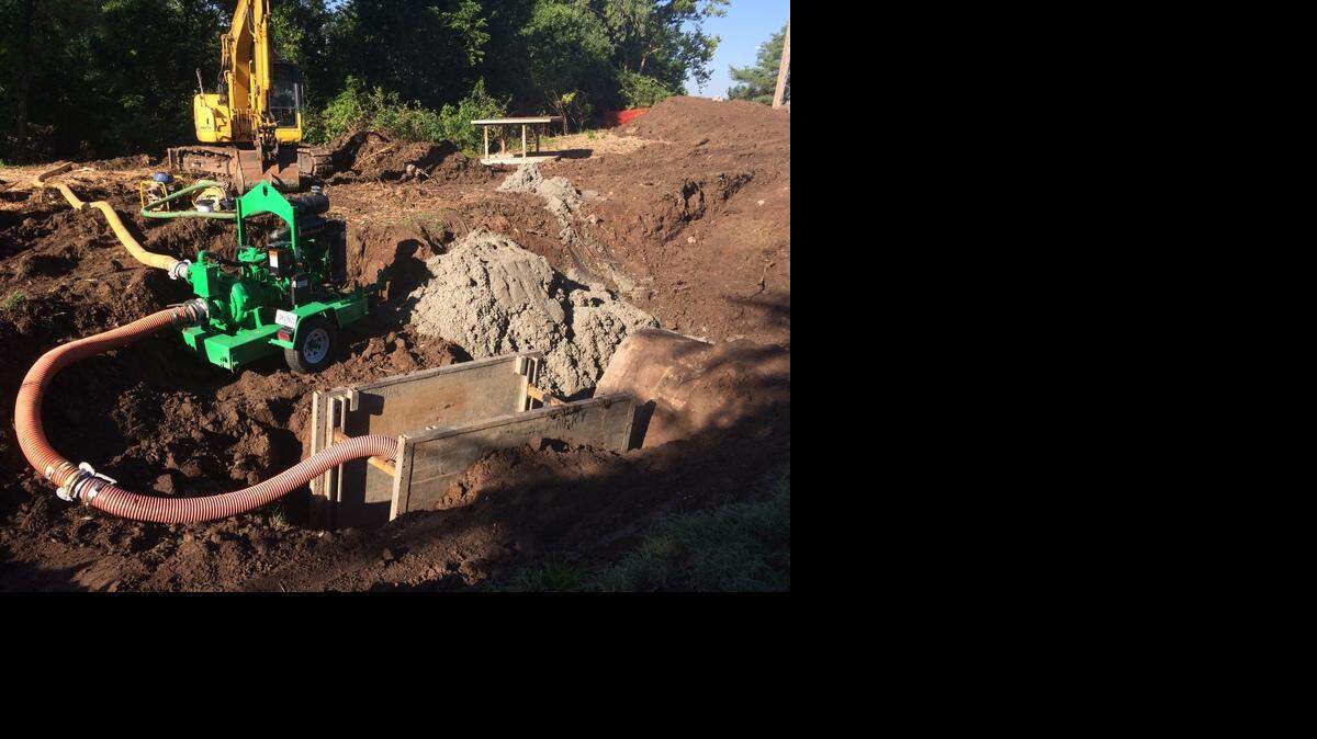 Pumping equipment was in place on Friday morning near Emanuel Cleaver II Boulevard and Elmwood Avenue after sewage spilled into Brush Creek overnight.