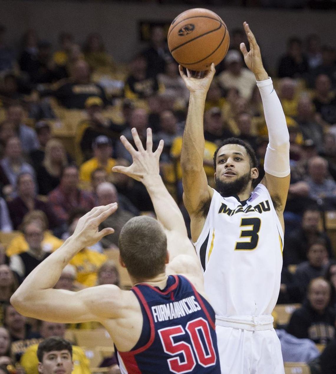 Missouri Tigers guard Kassius Robertson (3) scored on a jumper over Mississippi Rebels forward Justas Furmanavicius (50) in the first half during the University of Missouri and University of Mississippi Southeastern Conference basketball game at Mizzou Arena on Tuesday, February 20, 2018, in Columbia, Missouri.