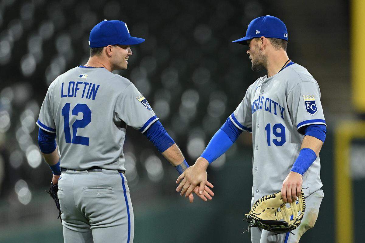 Nick Loftin #12 and Michael Massey #19 of the Kansas City Royals celebrate a 12-1 win against the Chicago White Sox at Rate Field on August 27, 2025 in Chicago, Illinois.