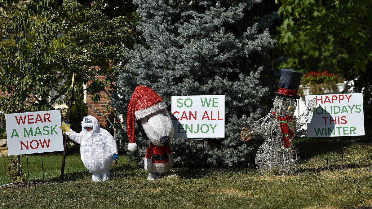 Kenneth Torres wanted to make the point that people need to take COVID-19 precautions seriously. So Torres, a retired plant cell biologist and business owner, used Halloween and Christmas decorations in a front yard display at his home in the Glenwood Estates neighborhood of Overland Park to convey this serious message in a fun way.