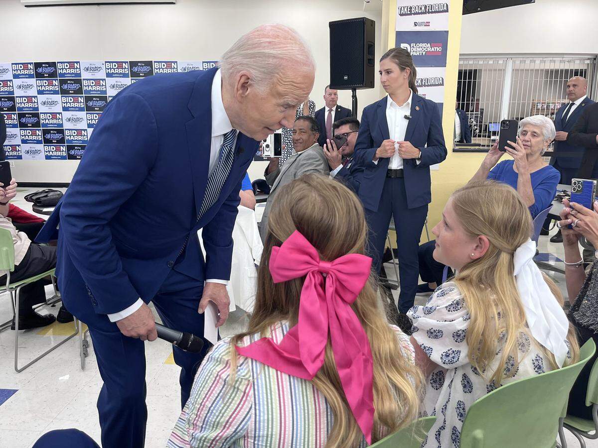 President Joe Biden tells two young girls they deserve ice cream for sitting through his campaign speech at Hillsborough Community College Dale Mabry in Tampa on Tuesday, April 23, 2024.