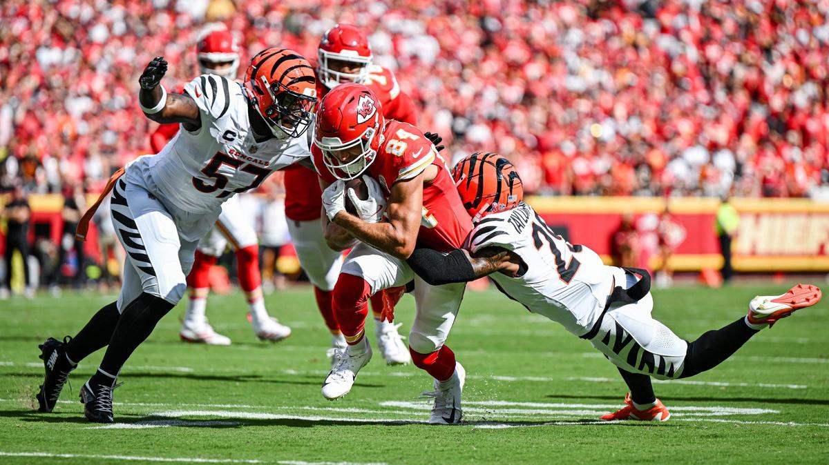 Kansas City Chiefs wide receiver Justin Watson (84) is taken down by Cincinnati Bengals linebacker Germaine Pratt (57) and cornerback Cam Taylor-Britt (29) after making a catch in the first quarter Sunday, Sept. 15, 2024, at GEHA Field at Arrowhead Stadium.